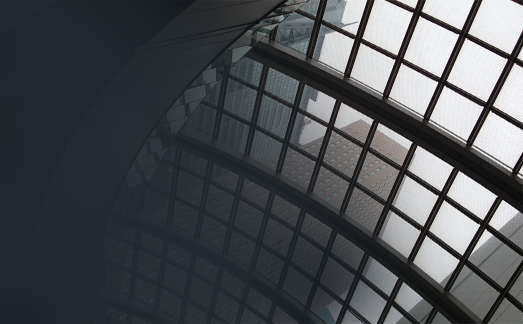 Steel-framed greenhouse structure with large glass panels.