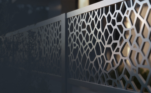 Brushed aluminum railings on modern deck with city view.